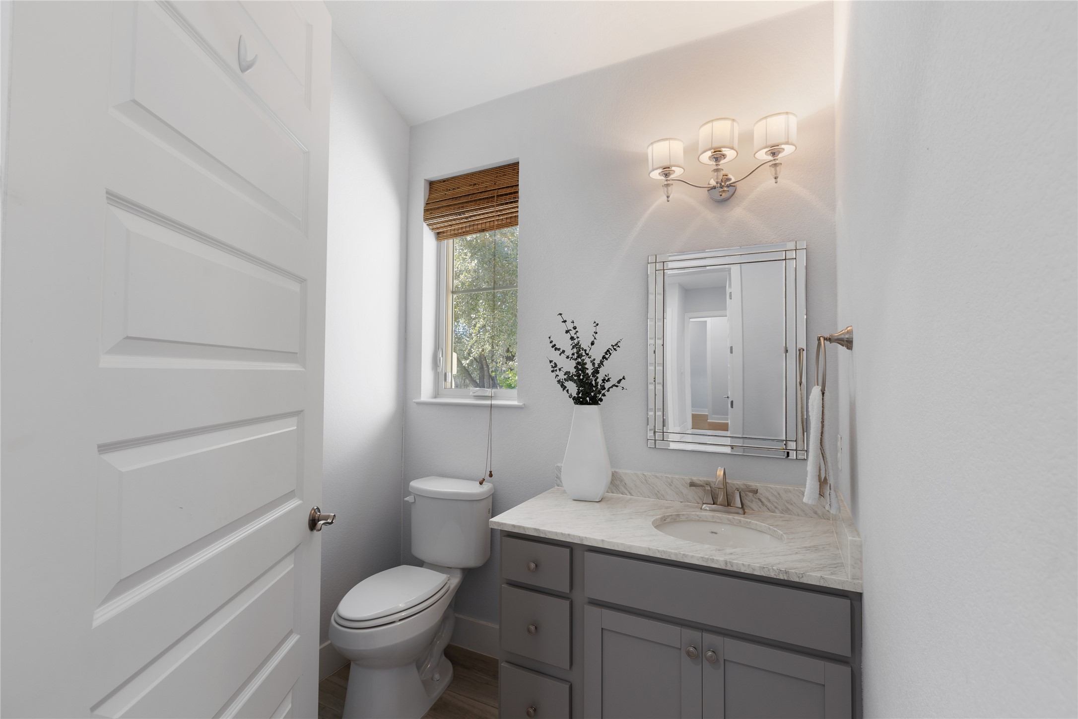 1821 Overland Stage Road Dripping Springs, TX 78620 - Photo 25 of 39 a bathroom with a toilet a sink and mirror