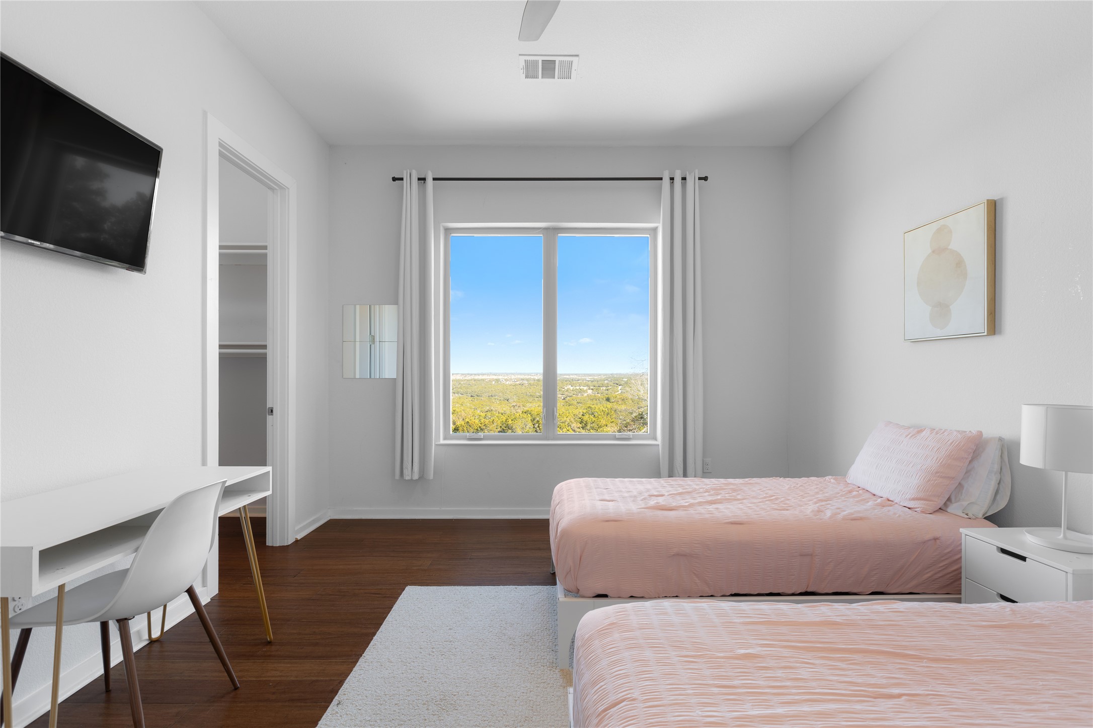 1821 Overland Stage Road Dripping Springs, TX 78620 - Photo 27 of 39 a bedroom with a bed and a flat screen tv