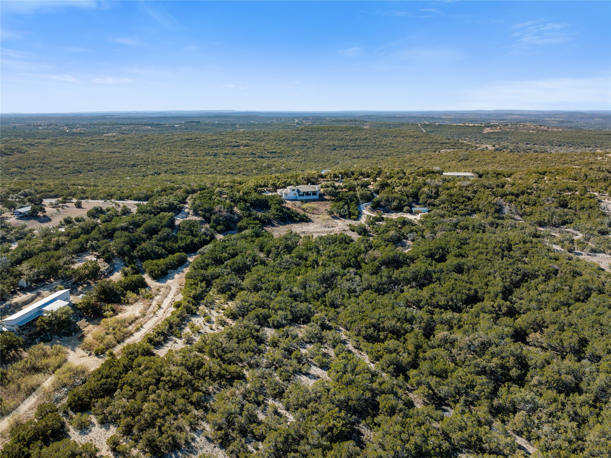 1821 Overland Stage Road Dripping Springs, TX 78620 - Photo 31 of 39 an aerial view of residential houses with outdoor space and trees