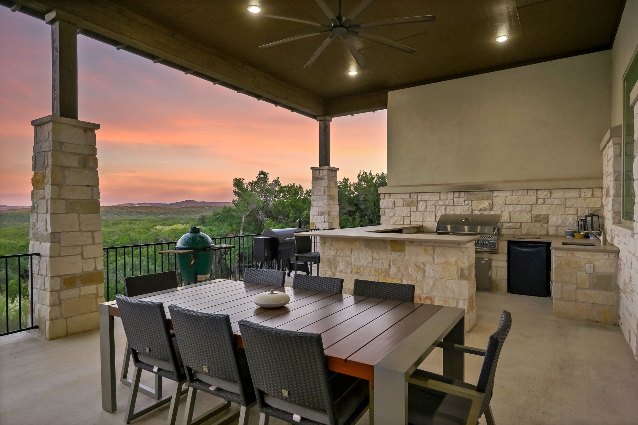 1821 Overland Stage Road Dripping Springs, TX 78620 - Photo 33 of 39 a view of a dining table and chairs in the balcony