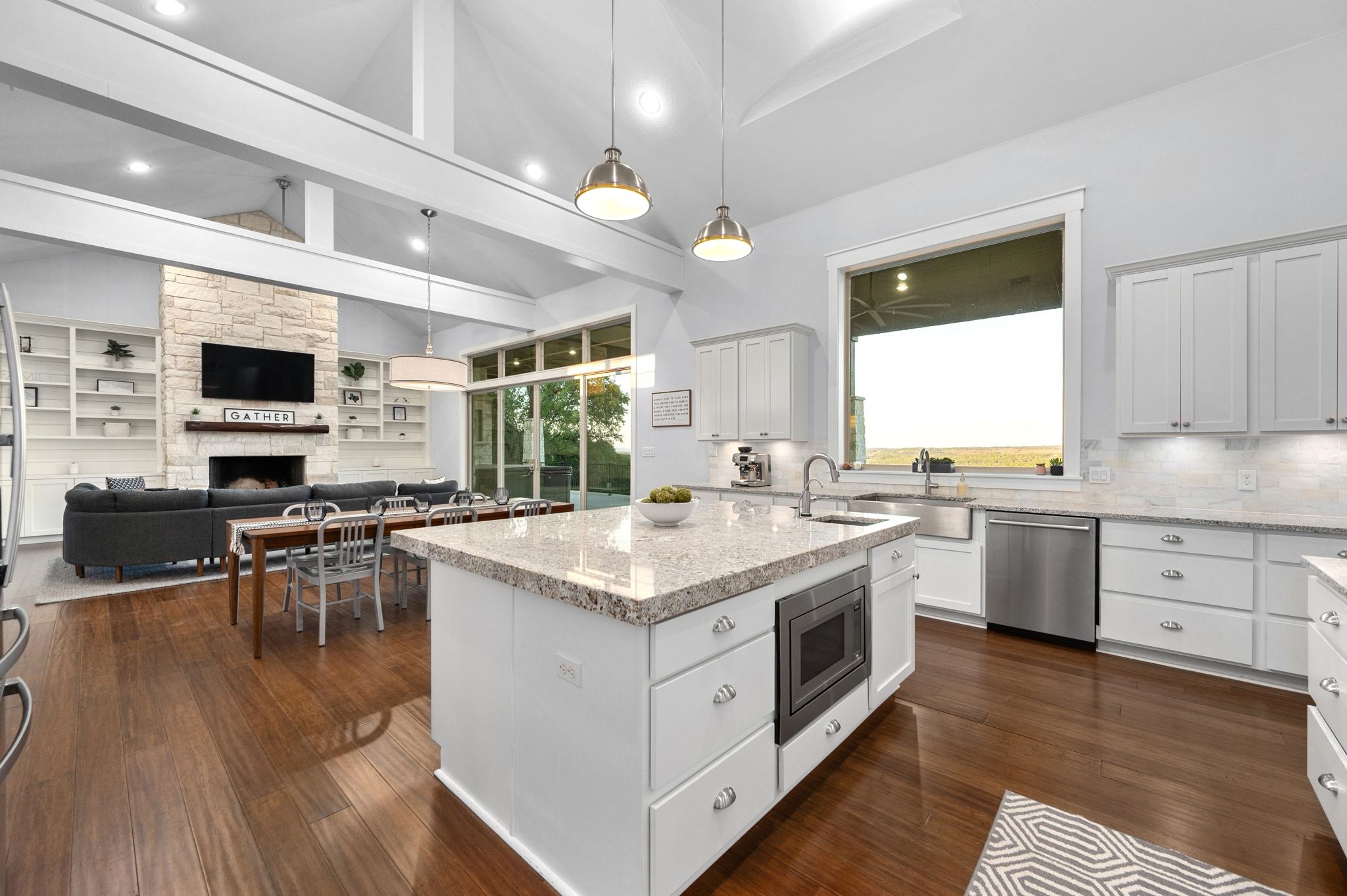 1821 Overland Stage Road Dripping Springs, TX 78620 - Photo 5 of 39 a kitchen with a stove and a microwave oven