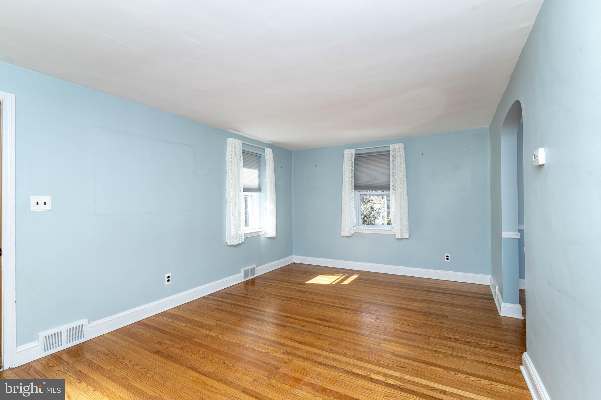 23 Wayfield Road Springfield, PA 19064 - Photo 8 of 38 a view of empty room with wooden floor and fan