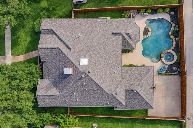 a aerial view of a house with a yard