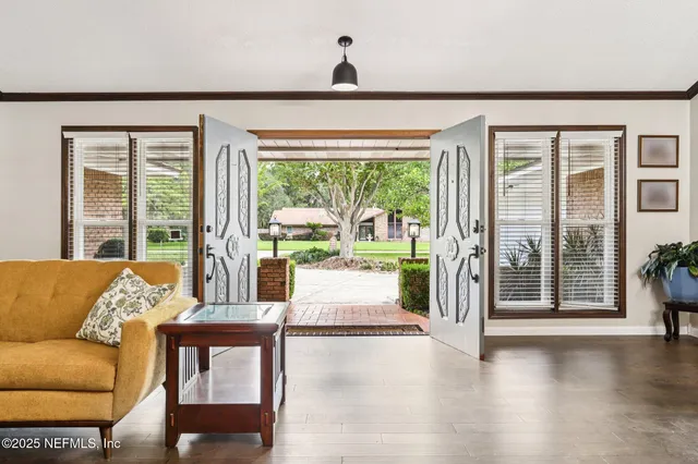 a kitchen with stainless steel appliances a stove microwave and sink
