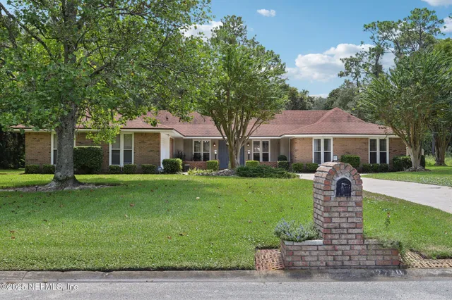 a bed room with furniture and a window