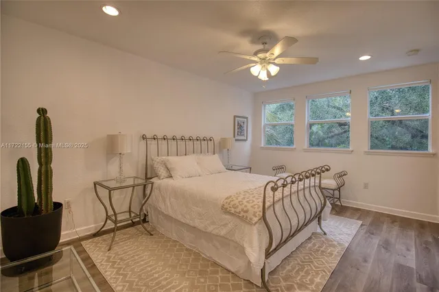 a bathroom with a tub a toilet and a shower