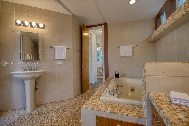 a living room with a couch and a table with rug