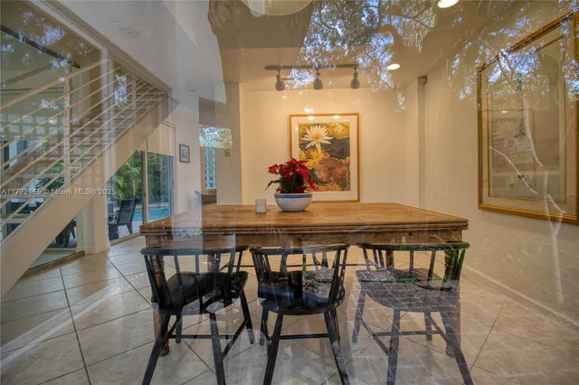 a backyard of a house with table and chairs