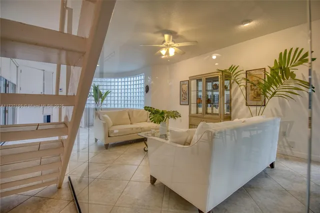 a kitchen with white cabinets and appliances