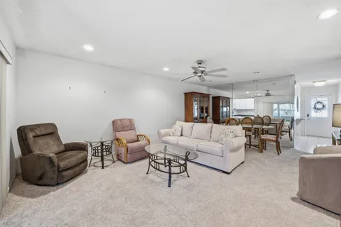 a view of a dining room with furniture and window