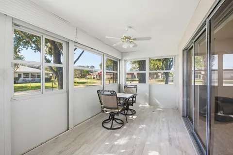 an aerial view of a house with a yard and garden