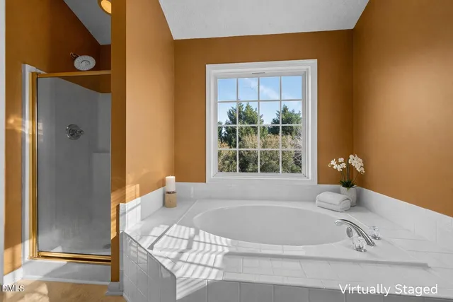 a white bath tub sitting next to a window