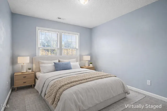 a bedroom with a bed and a tv