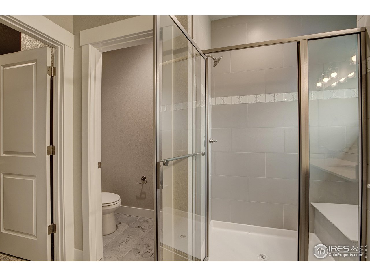 6227 Vernazza Way, Unit 2 Windsor, CO 80550 - Photo 11 of 35 a bathroom with a shower