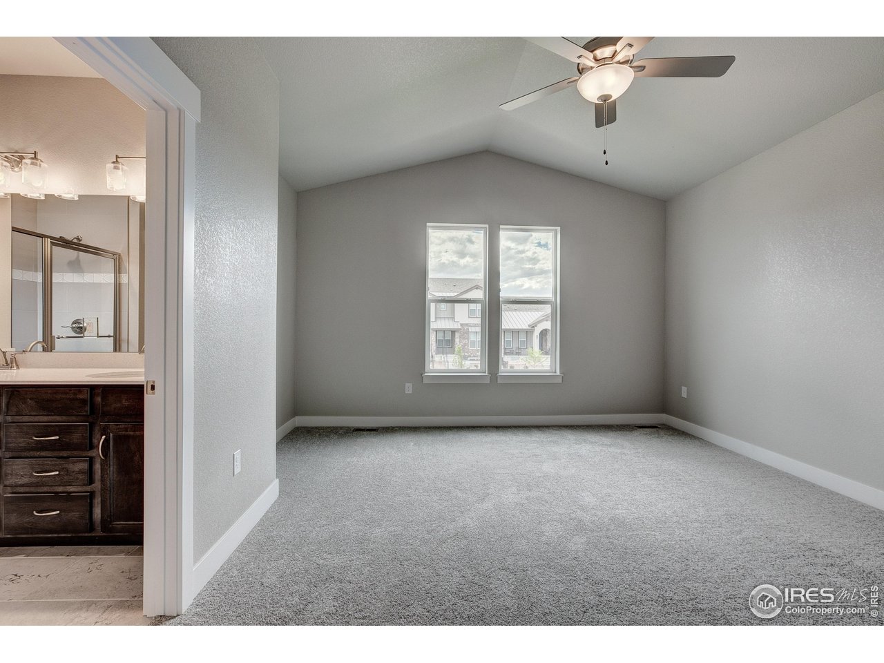 6227 Vernazza Way, Unit 2 Windsor, CO 80550 - Photo 14 of 35 a view of an empty room with a window