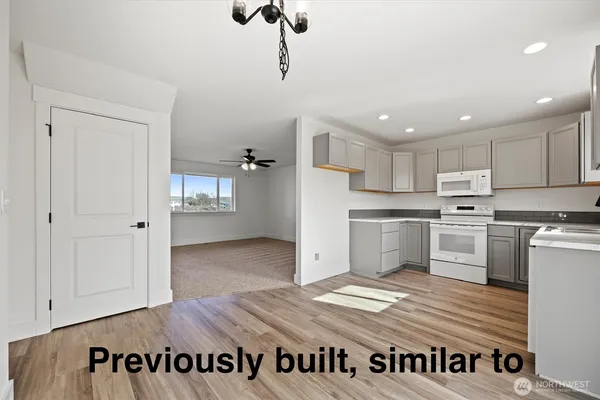 a view of kitchen with wooden floor