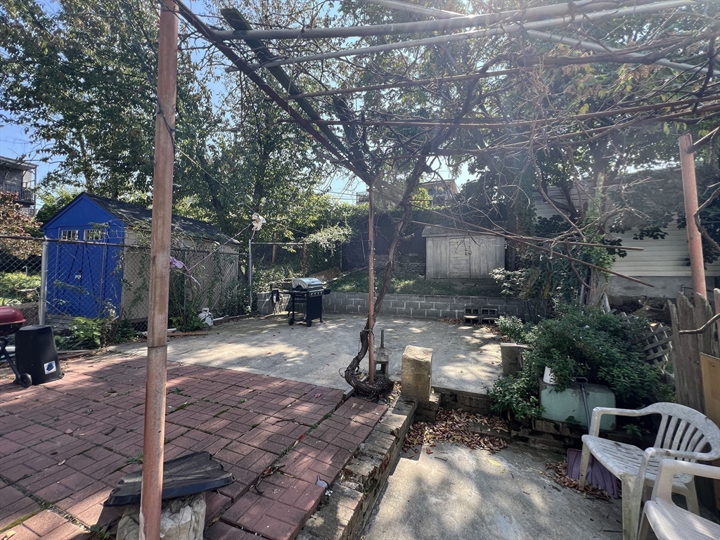 71 West Eagle Street, Unit 2 Boston, MA 02128 - Photo 26 of 31 a backyard of a house with yard and outdoor seating