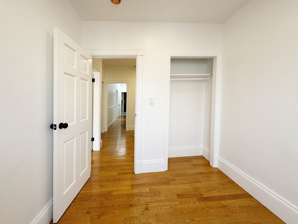 71 West Eagle Street, Unit 2 Boston, MA 02128 - Photo 7 of 31 a view of a bathroom with a hallway