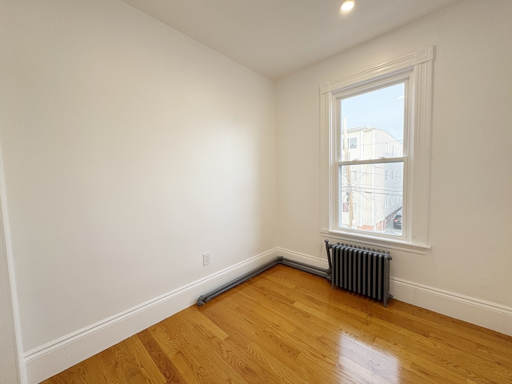 71 West Eagle Street, Unit 2 Boston, MA 02128 - Photo 8 of 31 an empty room with a window