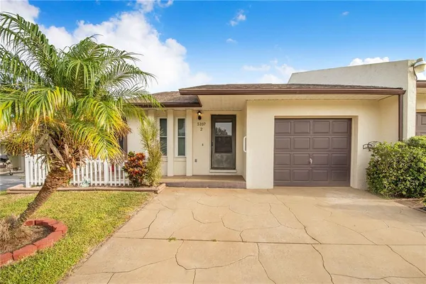 a view of house with outdoor space and glass windows