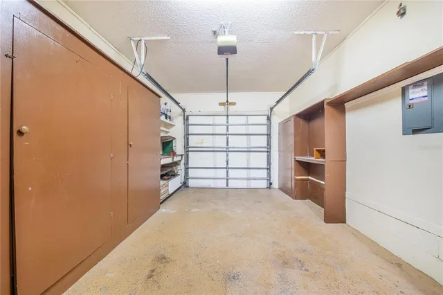 a view of a kitchen with storage and utility room
