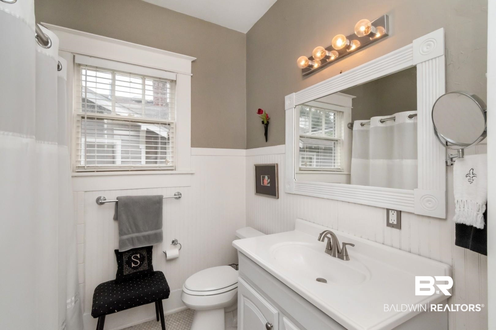 135 Silverwood Street Mobile, AL 36607 - Photo 16 of 32 Bathroom featuring a shower with shower curtain, vanity, and wainscoting