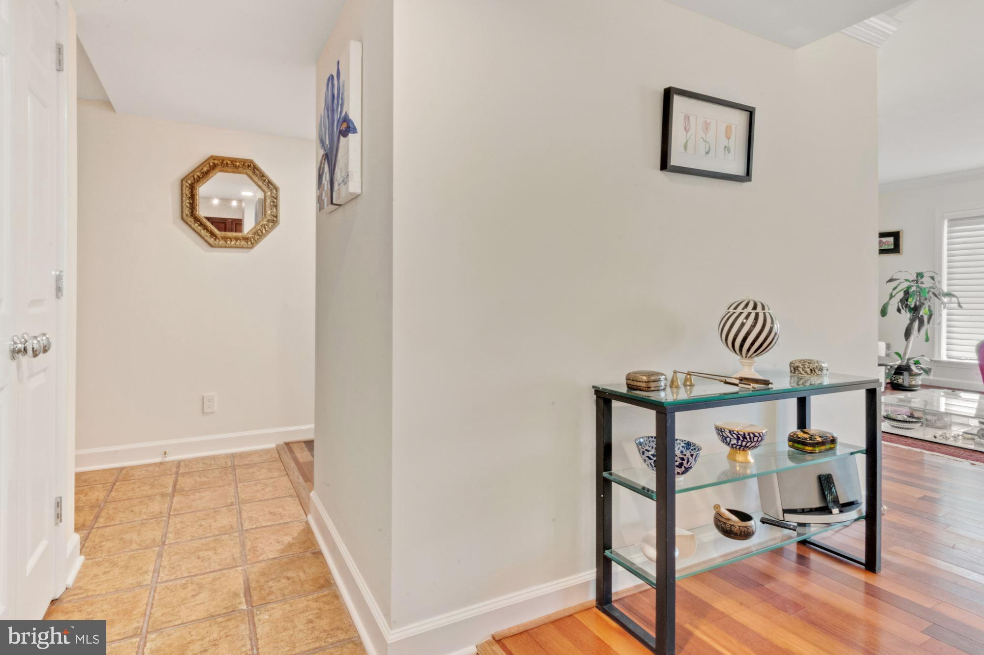 1080 Wisconsin Avenue Northwest, Unit 405 Washington, DC 20007 - Photo 16 of 31 a bedroom with a bed and a table in it