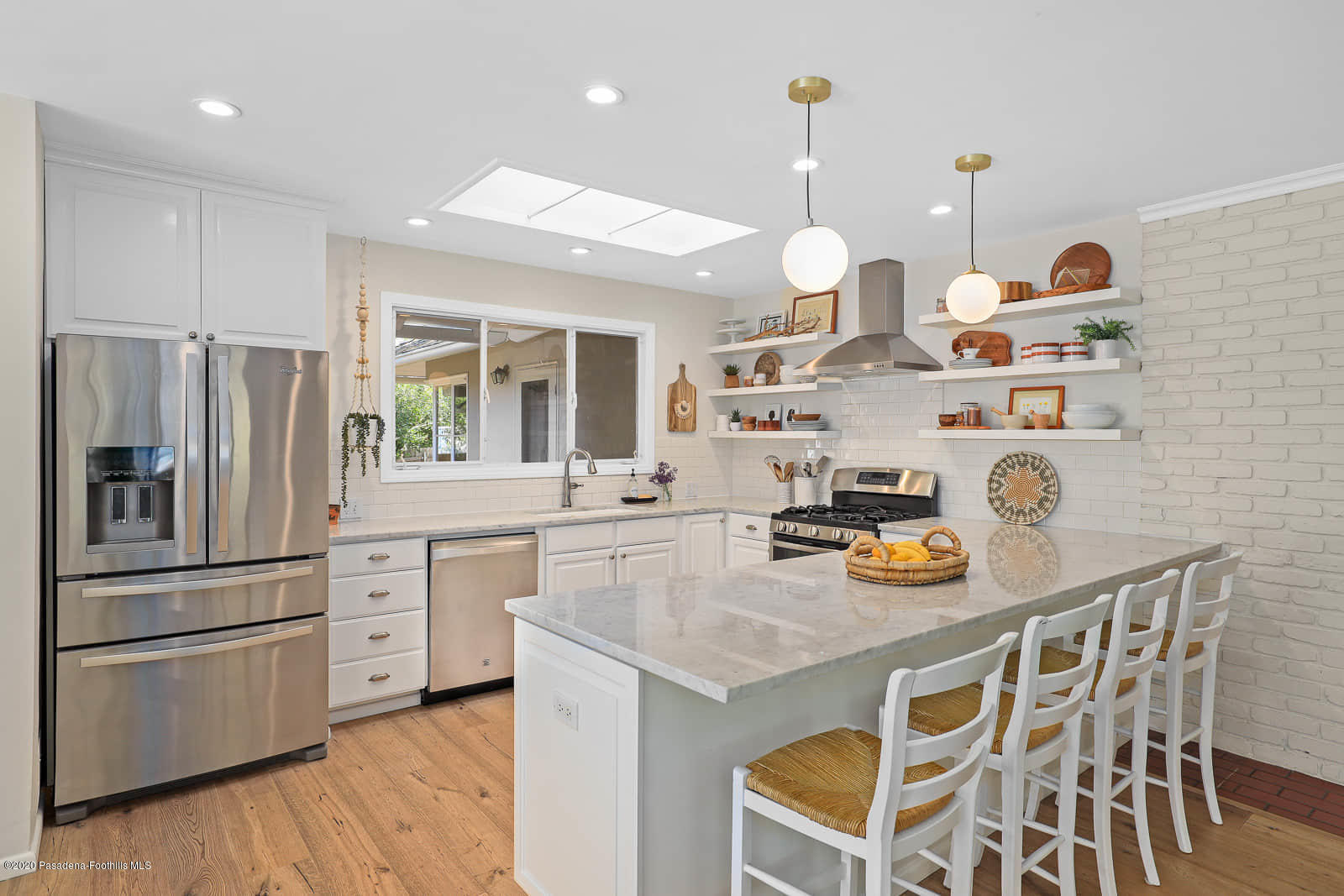 1955 Windover Road Pasadena, CA 91107 - Photo 16 of 71 a kitchen with a refrigerator a stove a sink and a dining table with wooden floor
