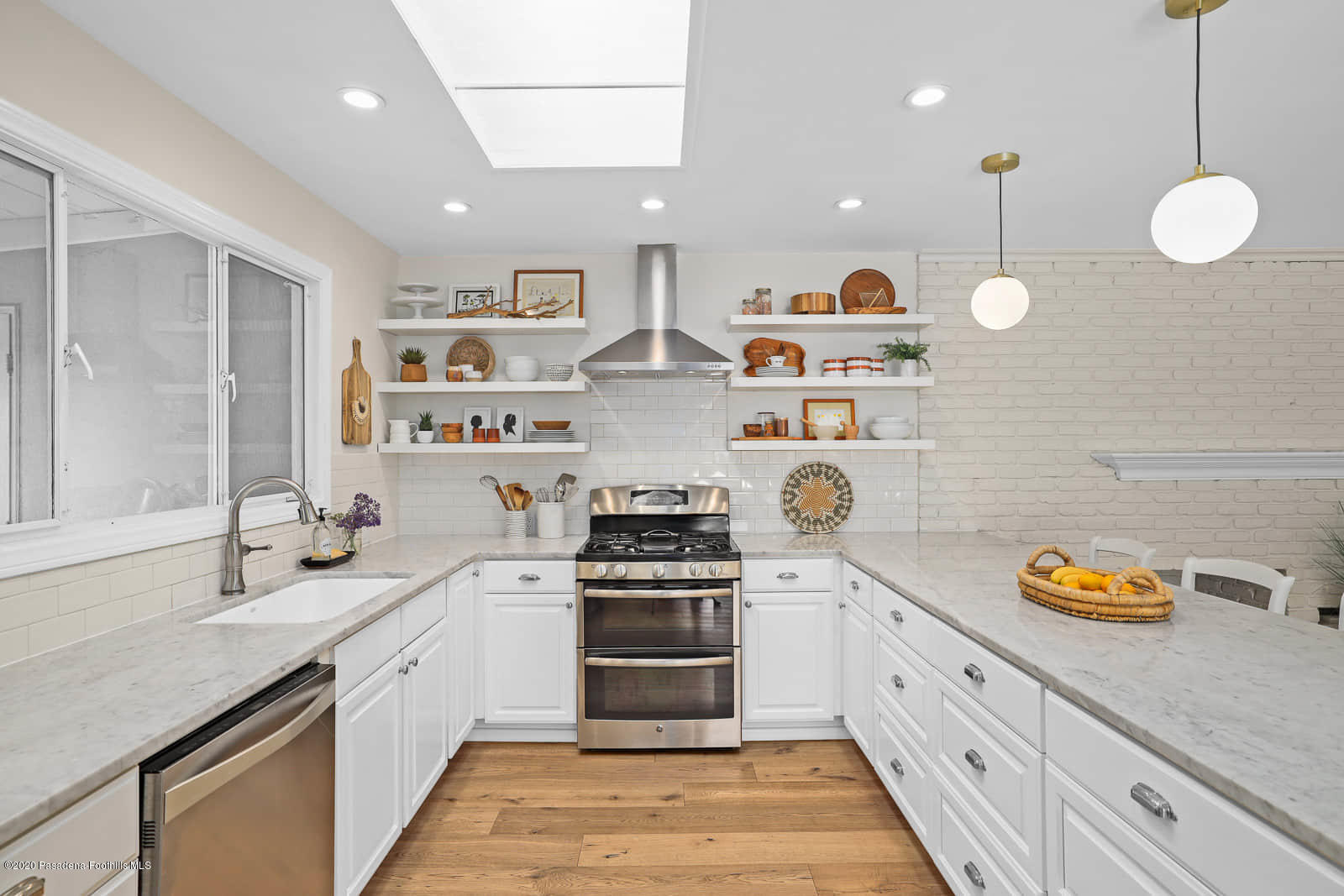 1955 Windover Road Pasadena, CA 91107 - Photo 17 of 71 a kitchen with stainless steel appliances granite countertop a sink a stove and a wooden floors