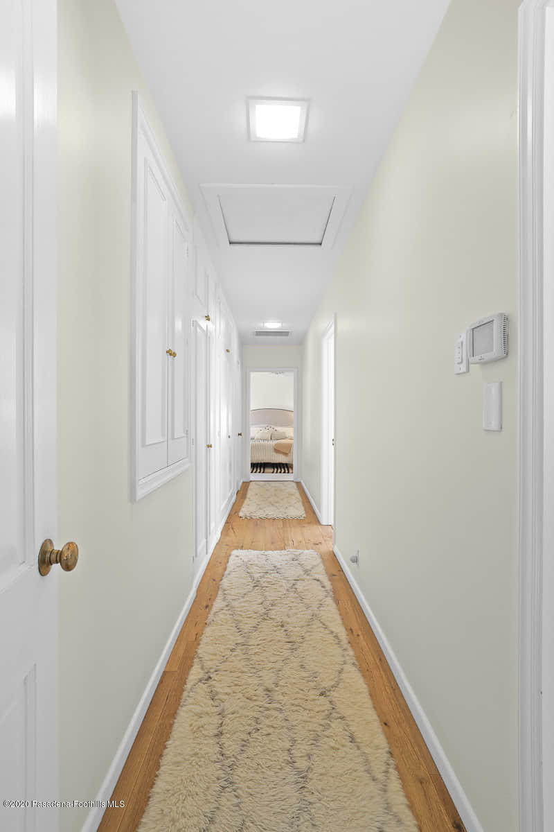 1955 Windover Road Pasadena, CA 91107 - Photo 23 of 71 a view of a hallway with wooden floor and a bathroom