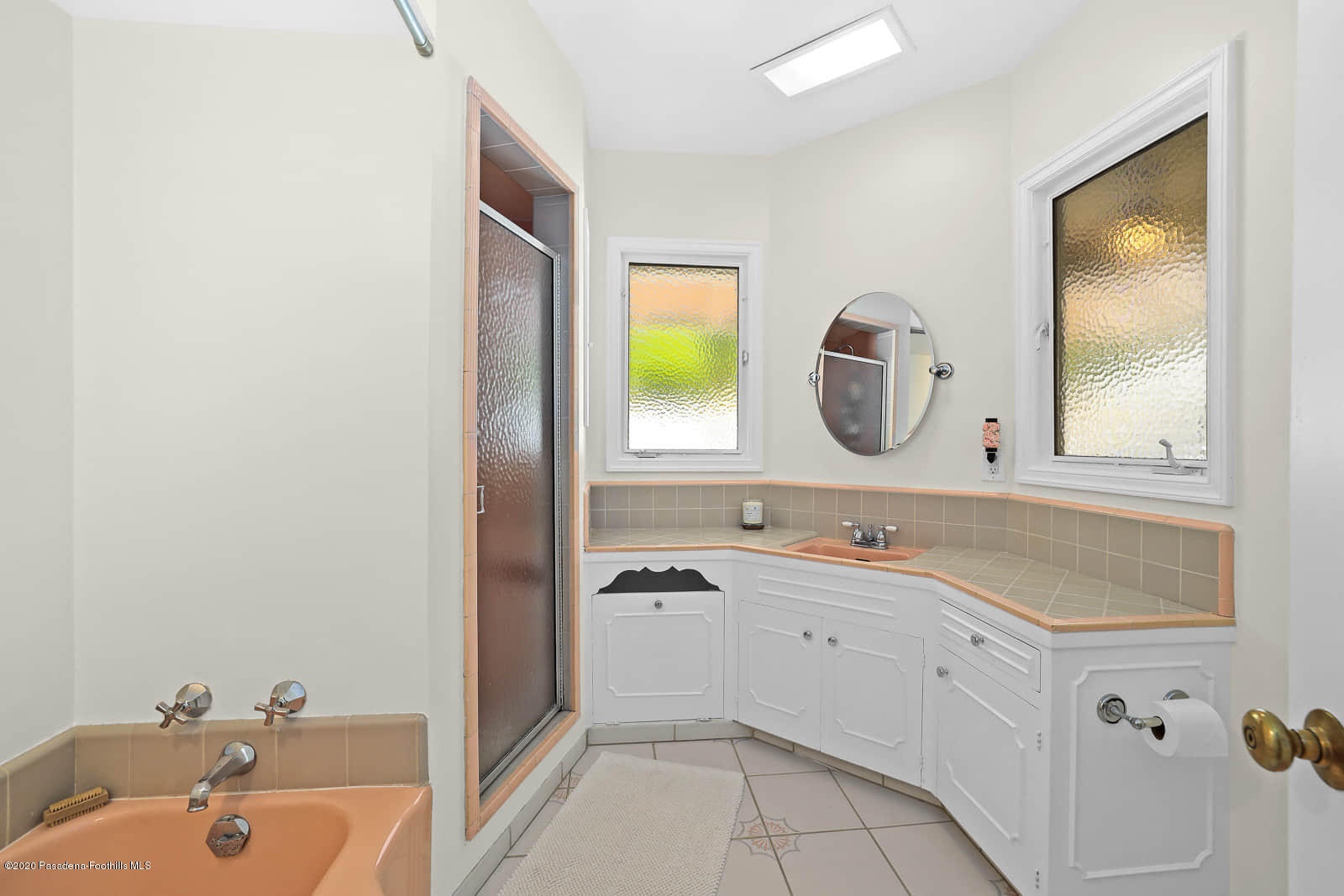 1955 Windover Road Pasadena, CA 91107 - Photo 25 of 71 a bathroom with a sink and a mirror