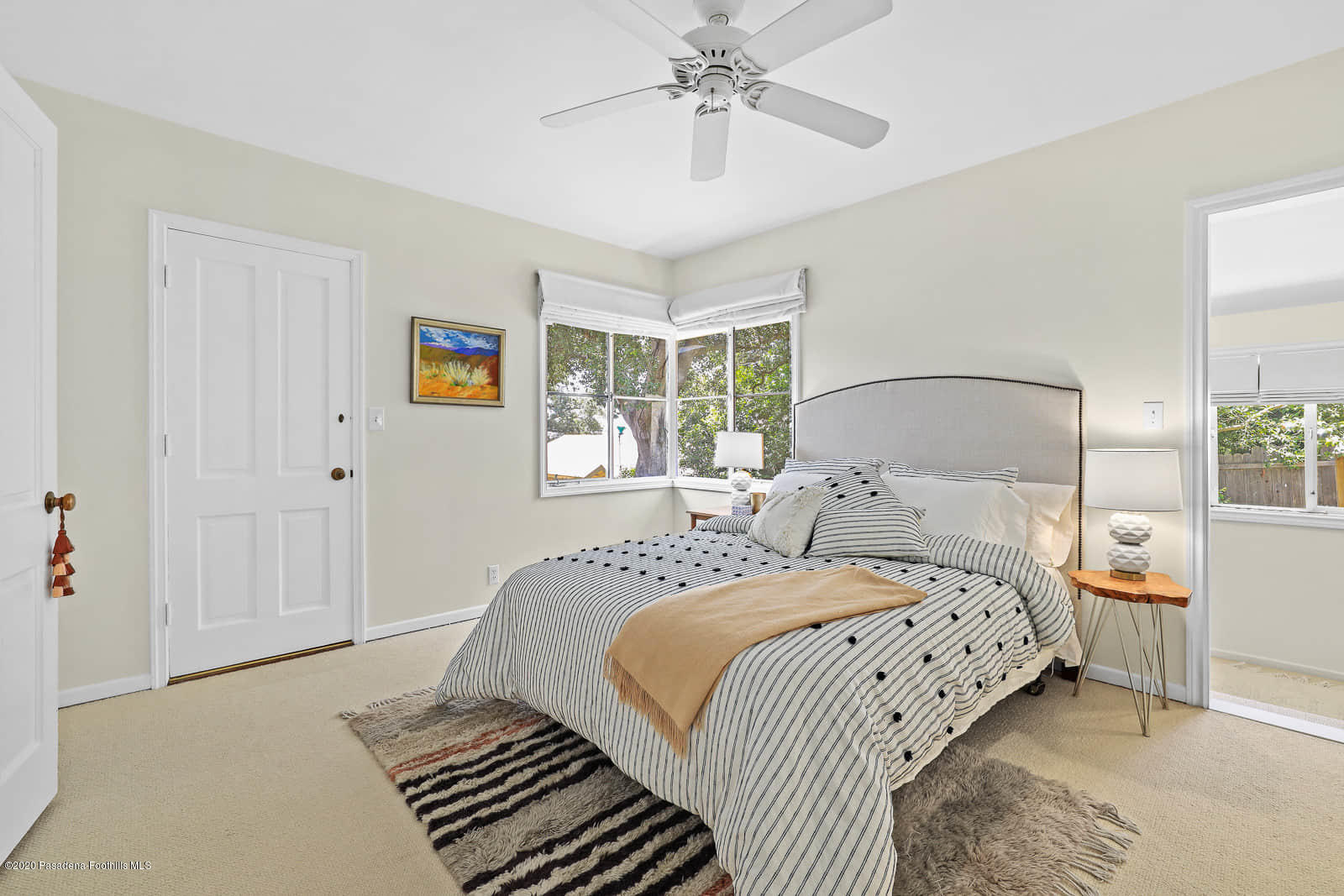1955 Windover Road Pasadena, CA 91107 - Photo 27 of 71 a bedroom with a large bed and a chandelier