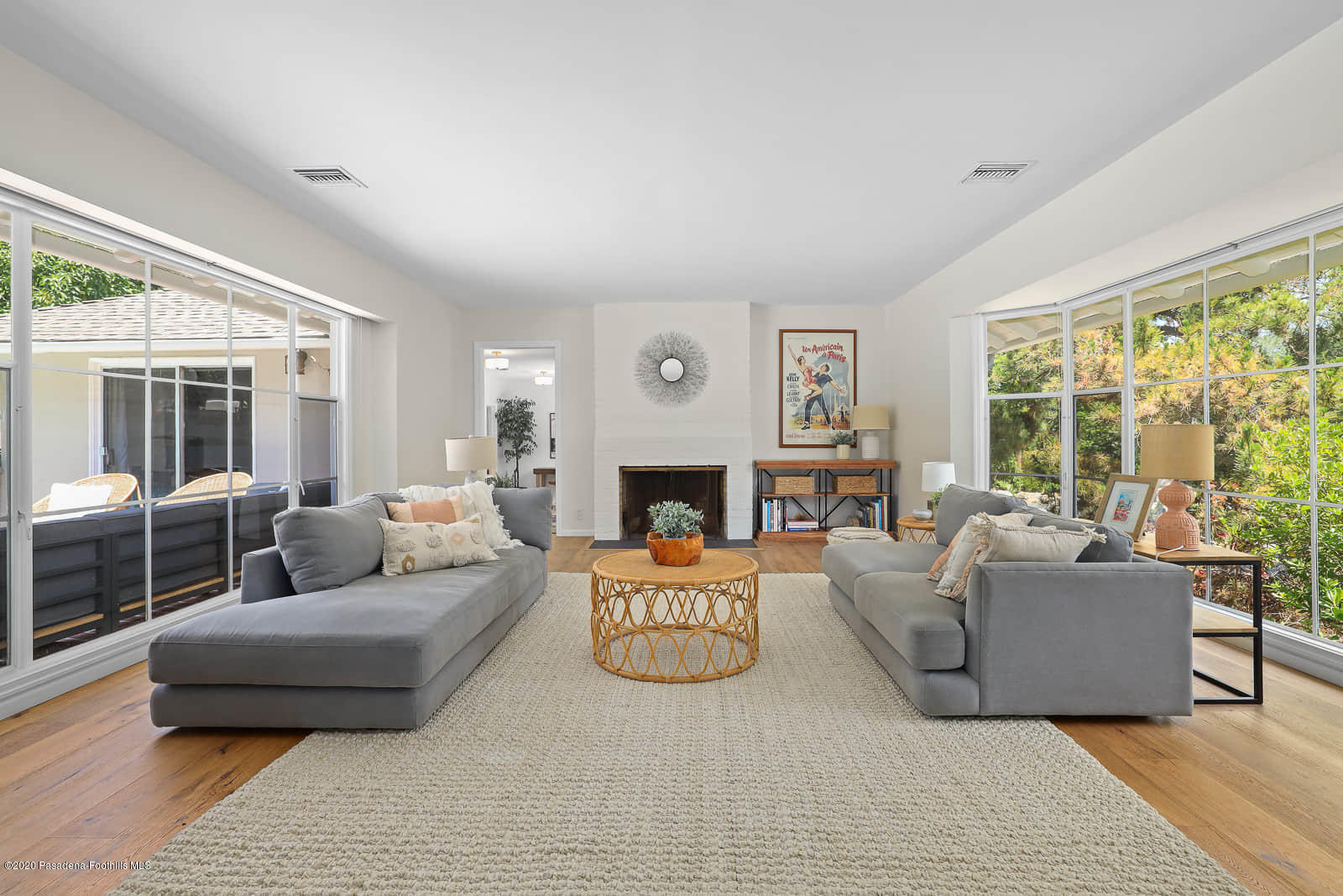 1955 Windover Road Pasadena, CA 91107 - Photo 32 of 71 a living room with furniture a large window and a fireplace