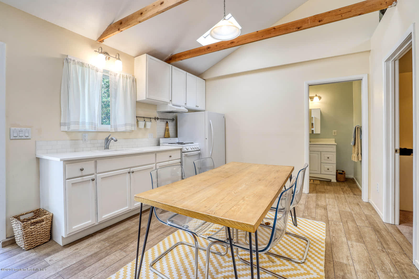 1955 Windover Road Pasadena, CA 91107 - Photo 58 of 71 a kitchen with a table chairs refrigerator and cabinets