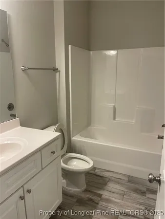 a bathroom with a sink a toilet and a bathtub