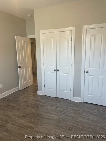 an empty room with wooden floor