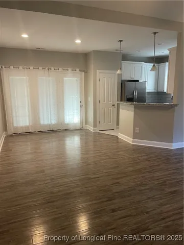 a view of kitchen with wooden floor