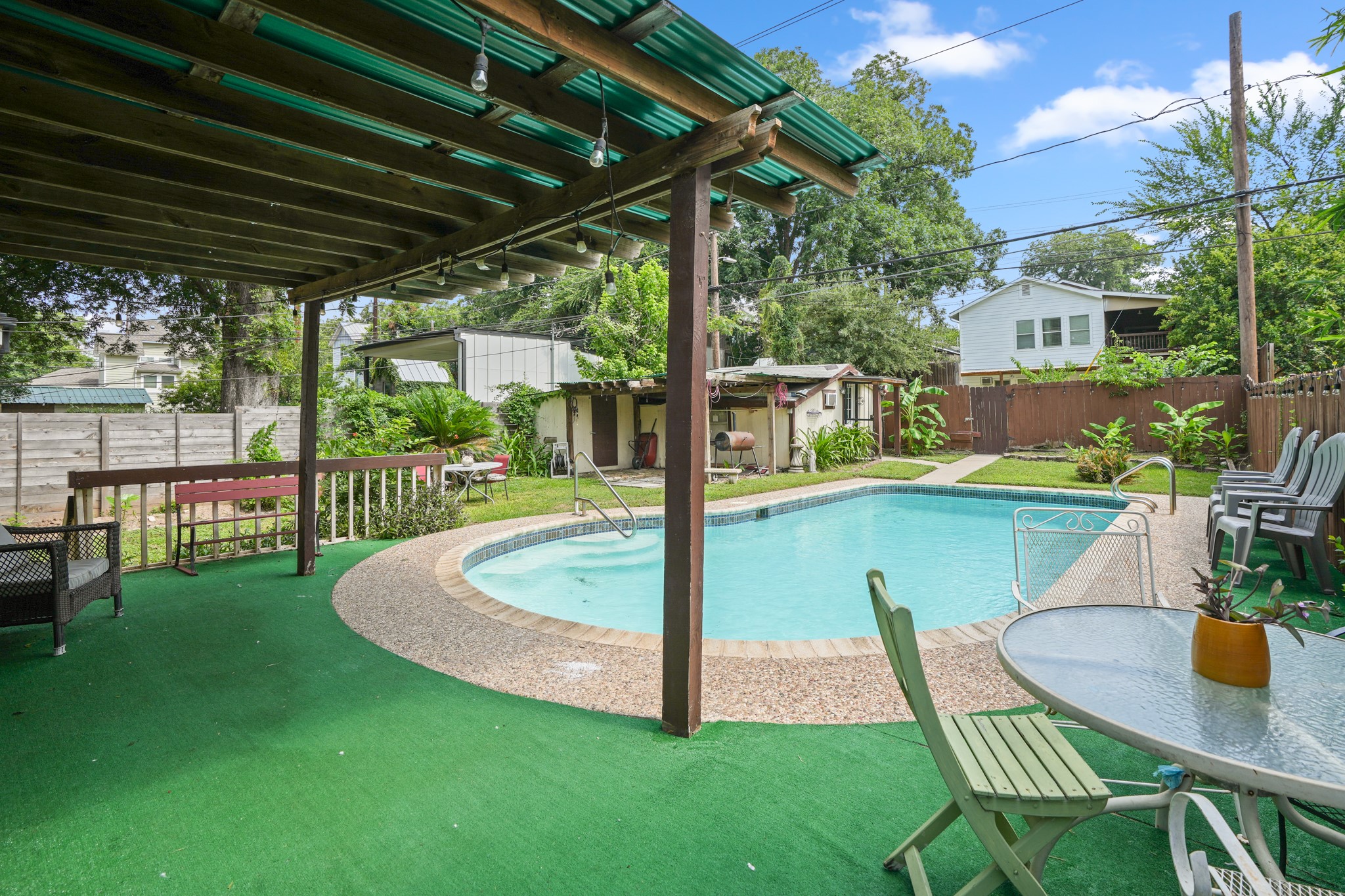 1908 Holly Street Austin, TX 78702 - Photo 21 of 22 An inviting pool area with a covered patio creates a refreshing outdoor retreat.