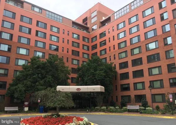 a view of a building with a yard