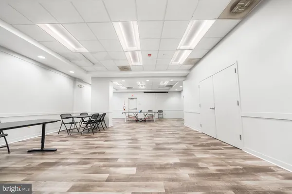 a room with gym equipment and lots of equipment