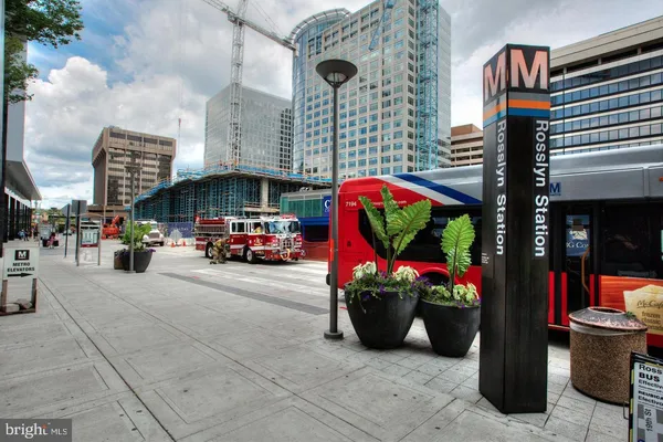 a view of a house with a swimming pool and sitting area
