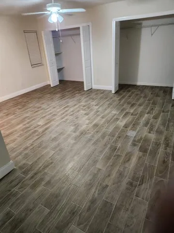 a view of an empty room with a mirror