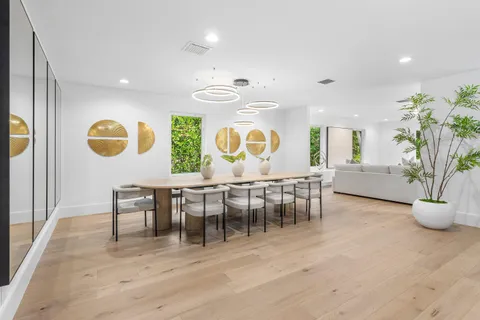 an open kitchen with a table and chairs