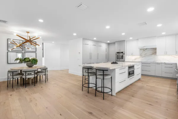 a kitchen with a table and chairs in it