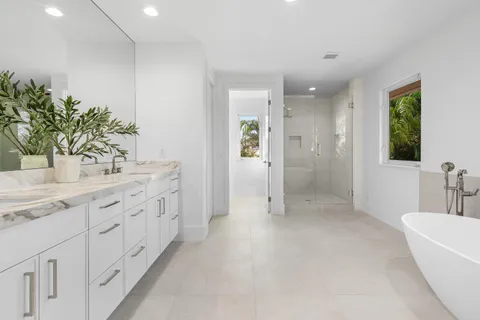 a bathroom with a bathtub and shower
