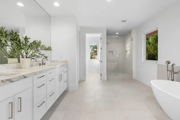 a bathroom with a bathtub and shower