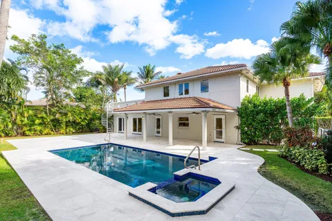 a view of swimming pool with lounge chair
