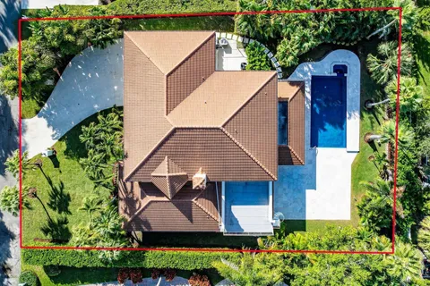 an aerial view of a house with a garden