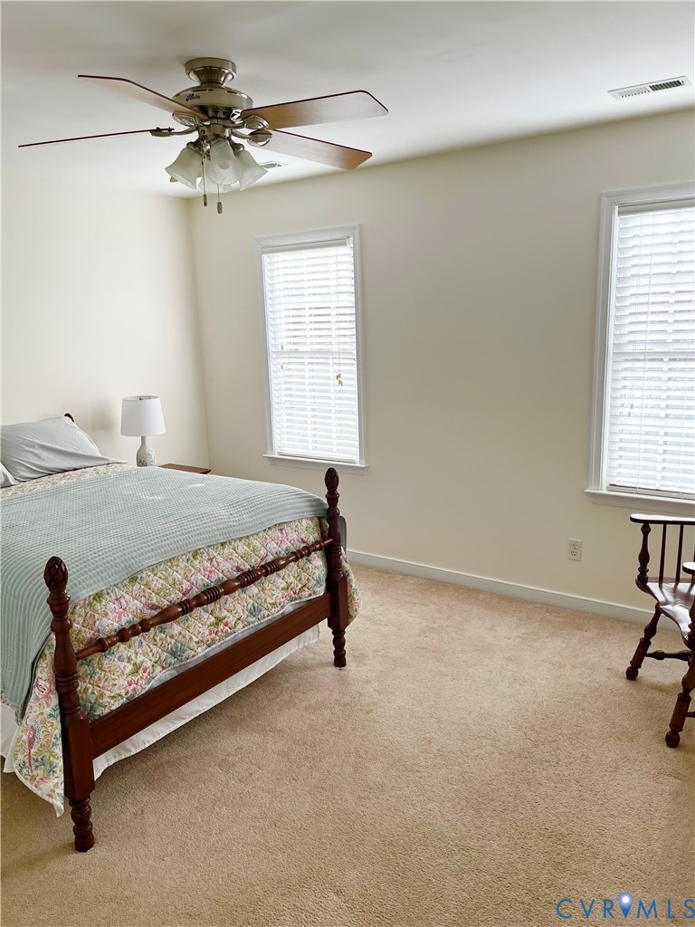 3420 Osborne Road Chester, VA 23831 - Photo 23 of 36 a bedroom with a bed and a table in it