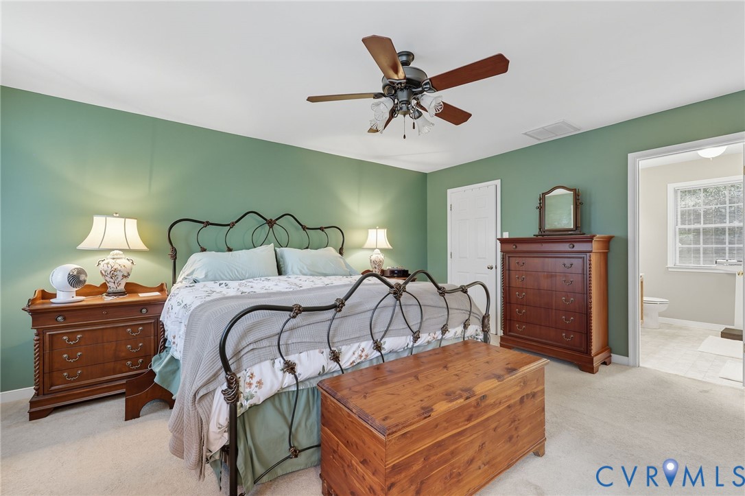 3420 Osborne Road Chester, VA 23831 - Photo 29 of 36 a bedroom with a bed and dresser with mirror